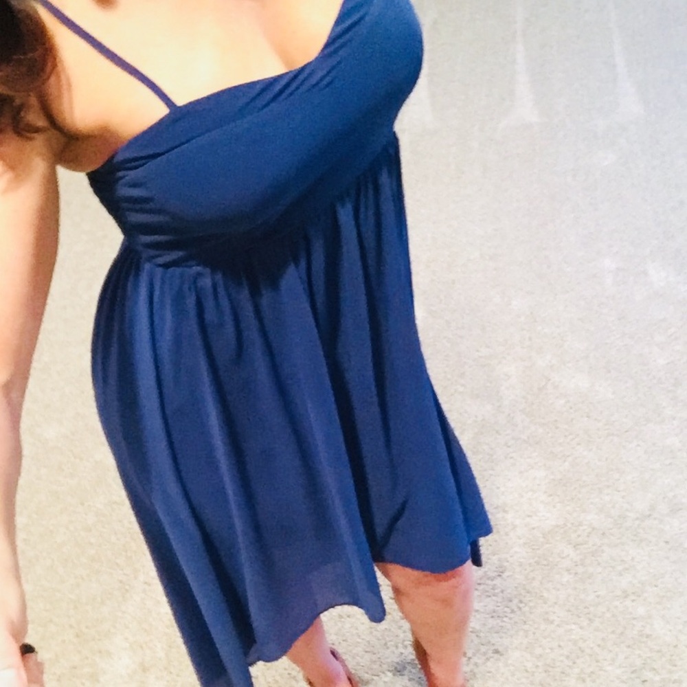 Royal blue asymmetric spaghetti strap dress.